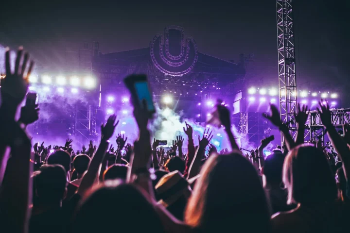Audience with raised hands during a concert
