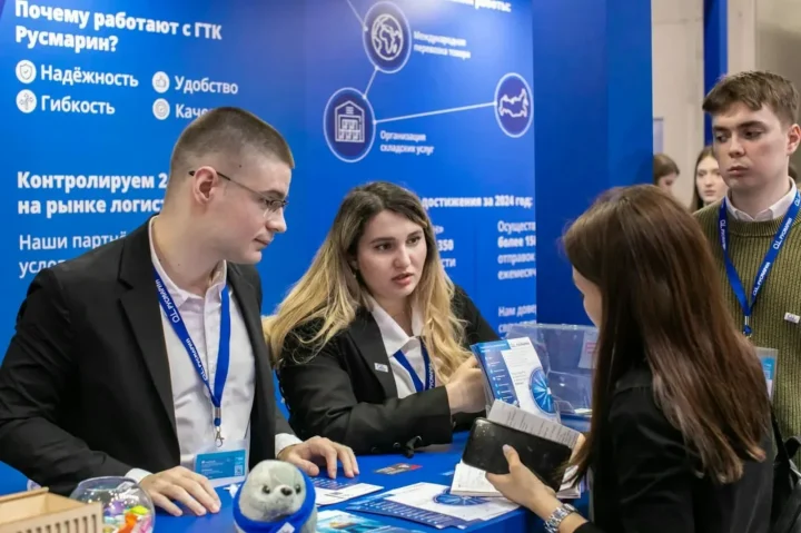Visitors at a trade show stand