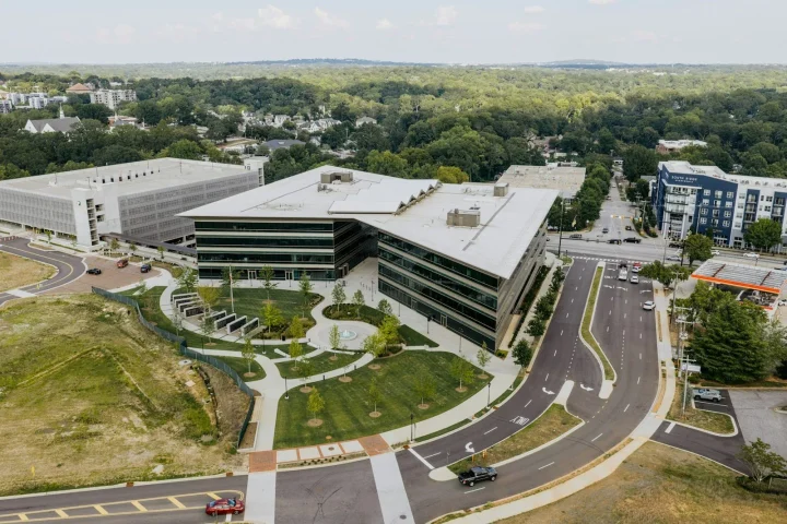 Aerial view of an office building and its landscaped courtyard
